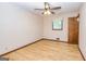 Comfortable bedroom with hardwood floors, a ceiling fan, and a window at 8289 Lake View Ter, Riverdale, GA 30274