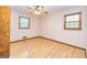 Bright bedroom with hardwood floors and two windows, providing plenty of natural light at 8289 Lake View Ter, Riverdale, GA 30274