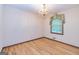 Formal dining area featuring hardwood floors, chandelier, and natural light at 8289 Lake View Ter, Riverdale, GA 30274