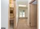 Hallway featuring carpet, doorways, and a view to the outside through sliding glass doors at 8289 Lake View Ter, Riverdale, GA 30274