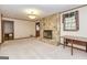 Cozy living room boasts a stone fireplace, creating a warm and inviting atmosphere at 8289 Lake View Ter, Riverdale, GA 30274