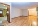 Large living room with hardwood floors, natural light, and stone fireplace at 8289 Lake View Ter, Riverdale, GA 30274