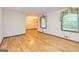 Open living room with hardwood floors, large windows and recessed lights at 8289 Lake View Ter, Riverdale, GA 30274