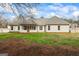 Spacious backyard with screened porch, perfect for outdoor entertaining and relaxation at 115 Stewart Hollow Ln, Covington, GA 30016