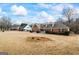 Expansive front yard and well-maintained lawn, highlighting the home's curb appeal and neighborhood setting at 115 Stewart Hollow Ln, Covington, GA 30016