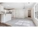 Eat-in kitchen area with updated lighting, an island, and access to backyard at 115 Stewart Hollow Ln, Covington, GA 30016