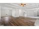 Open-concept living room featuring stylish lighting, hardwood floors, and plenty of space at 115 Stewart Hollow Ln, Covington, GA 30016