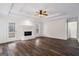 The living room boasts a fireplace, doors to the patio, and wood floors at 115 Stewart Hollow Ln, Covington, GA 30016