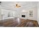 Spacious living room with wood floors, fireplace, and ample natural light at 115 Stewart Hollow Ln, Covington, GA 30016