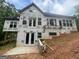 The new construction home featuring a walkout basement and large windows at 2012 Lakeview Pkwy, Villa Rica, GA 30180