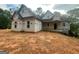New construction home with a covered porch and modern architectural design at 2012 Lakeview Pkwy, Villa Rica, GA 30180