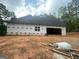 A new home under construction showing the garage and backyard space at 2012 Lakeview Pkwy, Villa Rica, GA 30180