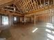 Large, open-concept living room framed with wooden supports and vaulted ceiling at 2012 Lakeview Pkwy, Villa Rica, GA 30180