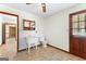 Functional bathroom with a toilet, sink, mirror, and access to the backyard at 370 Merrydale Dr, Fayetteville, GA 30215