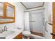 Bathroom featuring a walk-in shower, a tile floor, and vanity sink at 370 Merrydale Dr, Fayetteville, GA 30215