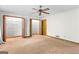 Carpeted bedroom with multiple closets and natural lighting at 370 Merrydale Dr, Fayetteville, GA 30215