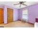 Cozy carpeted bedroom with a ceiling fan and natural light at 370 Merrydale Dr, Fayetteville, GA 30215
