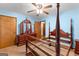 Light-blue bedroom with ceiling fan and wooden furniture at 370 Merrydale Dr, Fayetteville, GA 30215