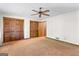 Bedroom featuring plenty of closet space and carpeted floors at 370 Merrydale Dr, Fayetteville, GA 30215