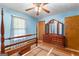 Bedroom with a wood frame bed, a dresser, and light blue walls at 370 Merrydale Dr, Fayetteville, GA 30215