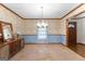 Traditional dining room with carpet, a chandelier, and decorative wallpaper at 370 Merrydale Dr, Fayetteville, GA 30215