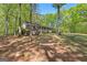 Beautiful home nestled among mature trees, offering a serene and private setting, with a welcoming front porch at 370 Merrydale Dr, Fayetteville, GA 30215