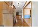 Cozy foyer with hardwood floors, decorative wallpaper, and an open view to the living room at 370 Merrydale Dr, Fayetteville, GA 30215