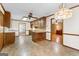 Spacious kitchen with an eat-in island, traditional cabinets, and connections to other rooms at 370 Merrydale Dr, Fayetteville, GA 30215