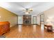 Open living room with hardwood floors, a brick fireplace, and natural light from the window at 370 Merrydale Dr, Fayetteville, GA 30215