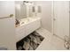 Traditional bathroom featuring a white vanity, large mirror, and coordinated rug at 1417 Se Pickett'S Ct, Conyers, GA 30013