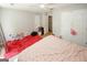 Spacious bedroom featuring carpeting, natural light, and ample closet space at 1417 Se Pickett'S Ct, Conyers, GA 30013
