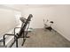 A dedicated exercise room with carpeted floors, a treadmill, and an exercise bike at 1417 Se Pickett'S Ct, Conyers, GA 30013