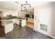 Modern open concept kitchen with white cabinets and view into the living area at 1417 Se Pickett'S Ct, Conyers, GA 30013