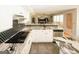 Modern, updated kitchen features marble countertops, stainless appliances, and black backsplash at 1417 Se Pickett'S Ct, Conyers, GA 30013