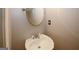 Stylish half bath features modern fixtures and wall mirror; renovated powder room at 1417 Se Pickett'S Ct, Conyers, GA 30013