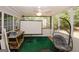 Sunroom with a comfortable hanging chair and open airy feel at 1417 Se Pickett'S Ct, Conyers, GA 30013
