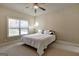 Bedroom with neutral walls, carpet and a ceiling fan with natural light from a window at 3705 Royer Ln, Hampton, GA 30228