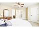 Bedroom with bathroom access, carpet, and view to upstairs hallway at 3705 Royer Ln, Hampton, GA 30228