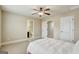 Bedroom with ensuite bathroom, neutral walls, carpet and ceiling fan at 3705 Royer Ln, Hampton, GA 30228