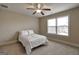 Bedroom with carpet, ceiling fan and a window with natural light at 3705 Royer Ln, Hampton, GA 30228