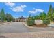 Welcoming entrance to Crystal Lake Golf and Country Club, featuring a stone sign, lush greenery, and brick-paved road at 3705 Royer Ln, Hampton, GA 30228