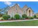 Lovely two-story brick home features professionally landscaped grounds, creating exceptional curb appeal for potential buyers at 3705 Royer Ln, Hampton, GA 30228