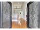 Inviting foyer with hardwood floors, a grand staircase, and a soaring two-story ceiling, offering a captivating entrance at 3705 Royer Ln, Hampton, GA 30228