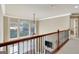 An upper-level hallway overlooks the living room and features large windows at 3705 Royer Ln, Hampton, GA 30228