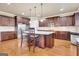 A spacious kitchen features stainless appliances, stone countertops, and a central island with seating at 3705 Royer Ln, Hampton, GA 30228