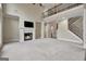 A spacious living room features a fireplace, high ceilings, and a view of the upper-level hallway at 3705 Royer Ln, Hampton, GA 30228