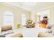 Bright living room featuring plush seating, neutral carpeting, and an open doorway, perfect for relaxing and entertaining at 3705 Royer Ln, Hampton, GA 30228