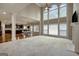 The spacious living room features a fireplace and opens to the kitchen and dining areas at 3705 Royer Ln, Hampton, GA 30228