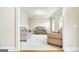 Bright living room features neutral carpet, large windows, and comfortable furniture, creating a welcoming atmosphere at 3705 Royer Ln, Hampton, GA 30228