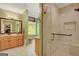 Bright bathroom with marble floors, oak vanity and walk-in shower at 140 Horton Creek Trl, Brooks, GA 30205
